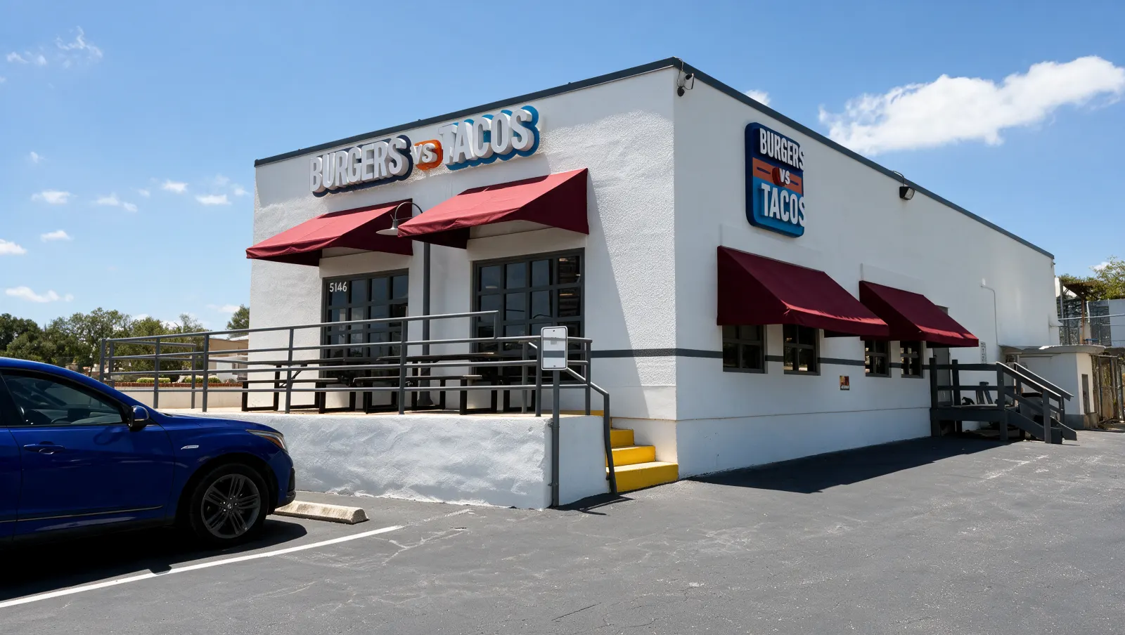 Burgers vs Tacos storefront seen from the corner, with wine-colored awnings