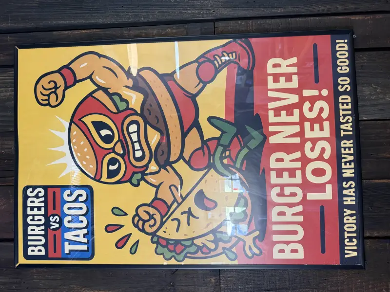 Poster of a wrestling burger defeating a taco
